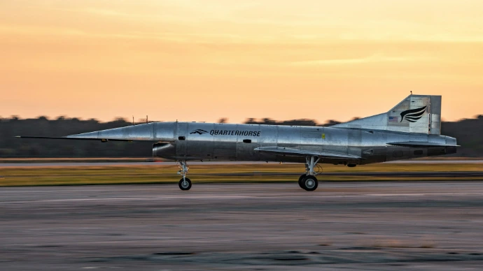 A fighter jet taking off from an airport runway